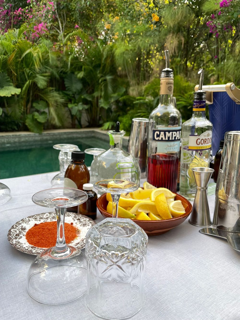Fresh lemons, Patrón, Campari and house-made syrups set up for a cocktail workshop
