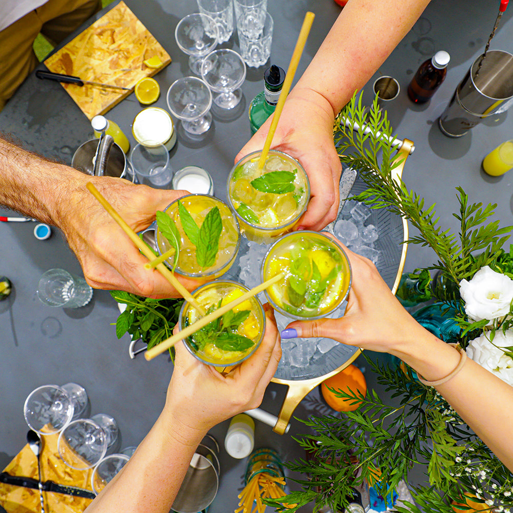 Friends raising cocktails they made at a NIJ & BIJ workshop